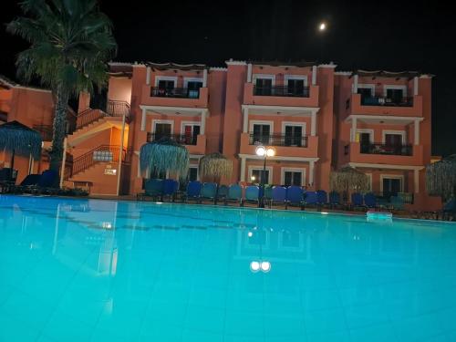 a large swimming pool in front of a building at Sidari Waterpark in Sidari