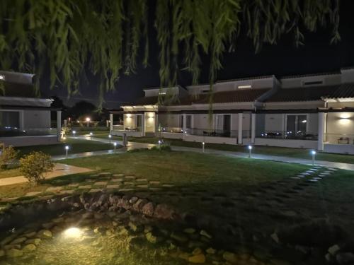 an image of a house at night with a pond at Sidari Waterpark in Sidari
