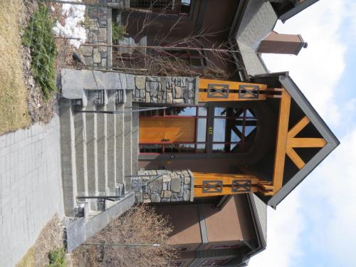 an external view of a building with a balcony at Buffaloberry Bed & Breakfast in Banff