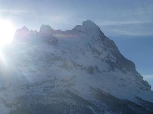 a mountain with a rainbow on top of it at Chalet Verbrunnenhaus Grindelwald in Grindelwald