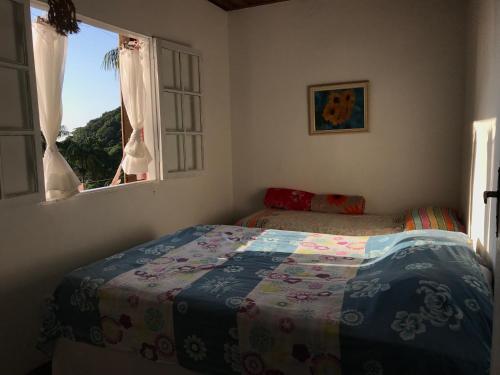 Postel nebo postele na pokoji v ubytování Suites do Félix