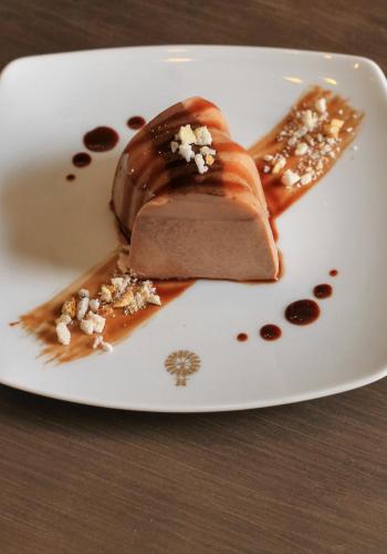 a plate with a chocolate dessert on a table at Verde Morada in Valladolid
