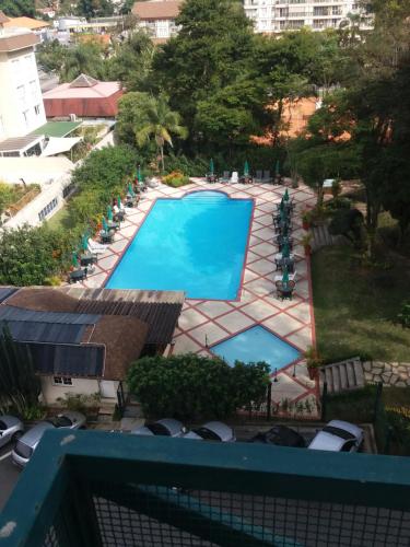 Vista de la piscina de Flat Conforto em Itaipava o d'una piscina que hi ha a prop