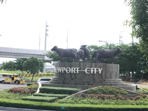 a statue of cows standing on top of a monument at 101 Newport Blvd Condotel in Manila