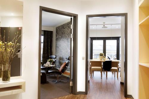 a hallway with a dining room and a living room at Hotel Svendborg in Svendborg