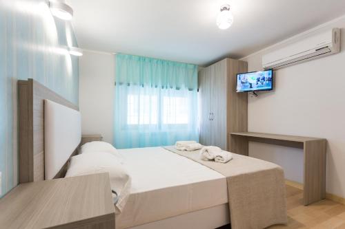 Ένα ή περισσότερα κρεβάτια σε δωμάτιο στο Luciano Laterani Guest House