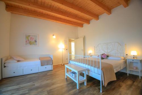Ένα ή περισσότερα κρεβάτια σε δωμάτιο στο B&B Dimora ROSSIPINTI