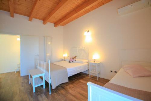 Ένα ή περισσότερα κρεβάτια σε δωμάτιο στο B&B Dimora ROSSIPINTI