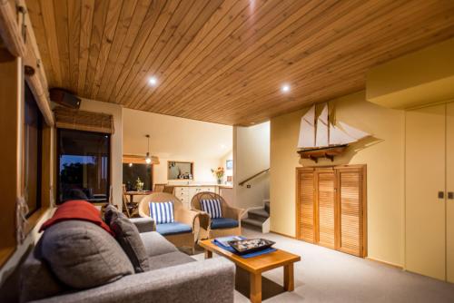 a living room with a couch and a table at The Wheelhouse Inn in Nelson