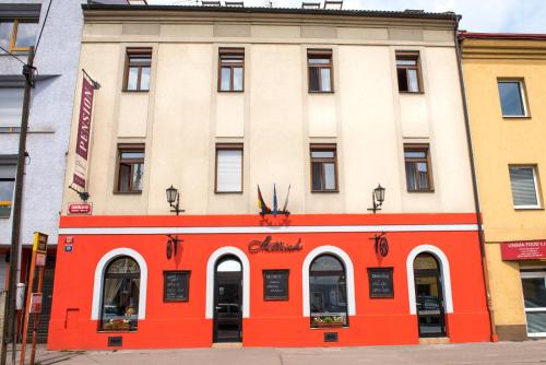 an orange and white building on a city street at Residence Hattrick in Prague