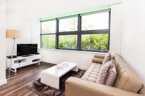 A seating area at City Stay Apartments - Centro 