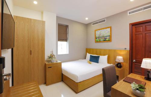 Ένα ή περισσότερα κρεβάτια σε δωμάτιο στο Golda Hotel