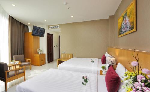 Ένα ή περισσότερα κρεβάτια σε δωμάτιο στο Golda Hotel
