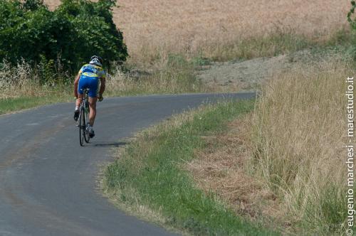 a person riding a bike down a road at Park Hotel Salice Terme - OltrePò Pavese - in Salice Terme