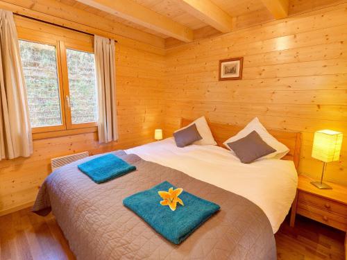Ένα ή περισσότερα κρεβάτια σε δωμάτιο στο Chalet in Les Collons near Ski Lift