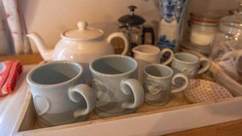 a group of cups sitting in a drawer at Glamping Bothie in Inverurie