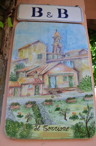 a cake with a drawing of a building at Il Torrione in Castiglione del Lago