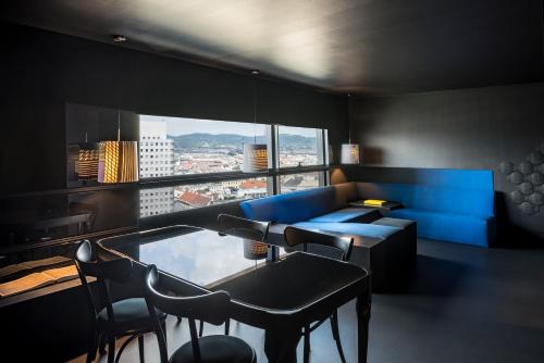 a living room with a view of a city at SO/ Vienna in Vienna