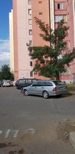 a row of cars parked in a parking lot at Isani Panorama in Tbilisi City