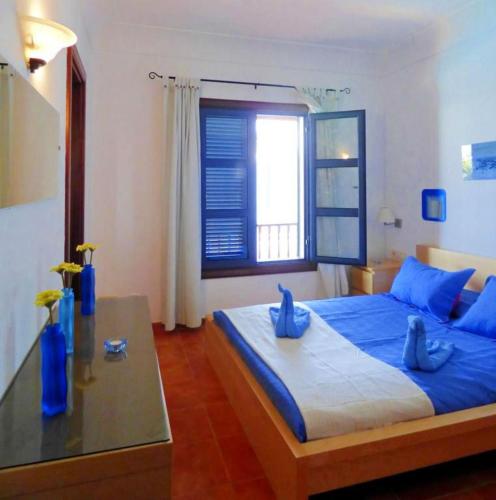 Postel nebo postele na pokoji v ubytování Villa Raima