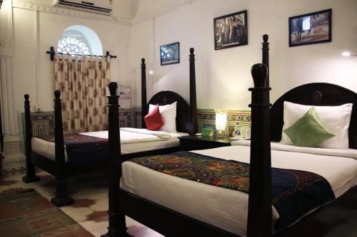 Cama ou camas em um quarto em Malji Ka Kamra