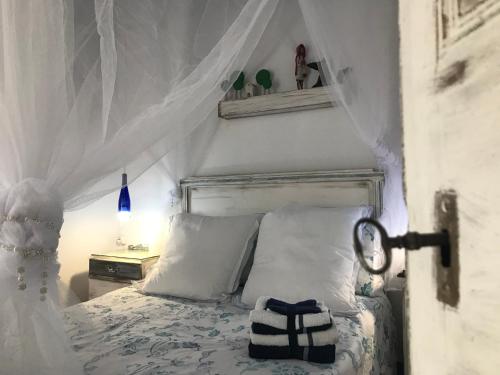 Ένα ή περισσότερα κρεβάτια σε δωμάτιο στο Ca L'Esquelleta casa rural by El Secret de la Conca