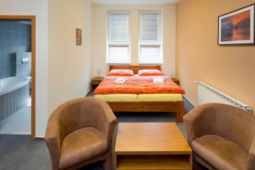 Posteľ alebo postele v izbe v ubytovaní Lipovka penzion