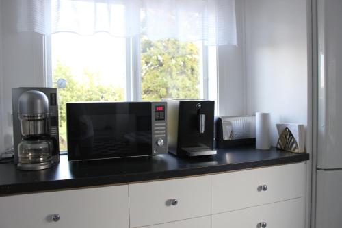 Η κουζίνα ή μικρή κουζίνα στο Ett hus med 3 sovrum med supersnabba internet fiberanslutningen 1000mb-100mb i Hög, 7 minuter från Hudiksvall