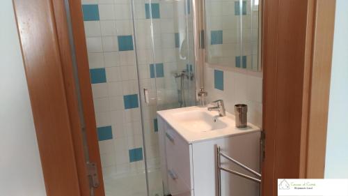 a bathroom with a sink and a shower at Casa D'Avó (R/C) in Altura