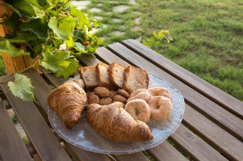 a plate of bread and pastries on a picnic table at Stagnone Area Zero in Birgi Vecchi