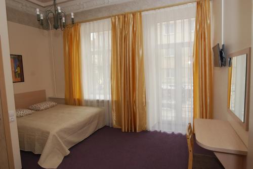 Postel nebo postele na pokoji v ubytování Vilnius centre house