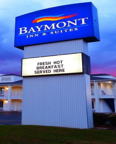 a sign for a baumont inn and suites at Baymont by Wyndham Columbia Maury in Columbia