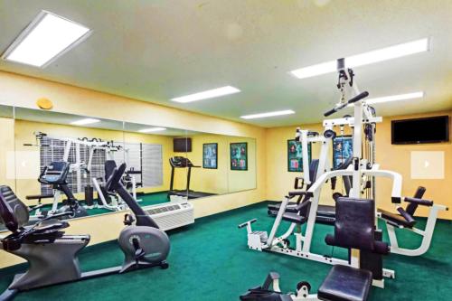 a gym with treadmills and machines in a room at Baymont by Wyndham Columbia Maury in Columbia