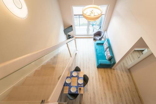 an overhead view of a living room with a table at Apartamenty Polanica MyWeek in Polanica-Zdrój