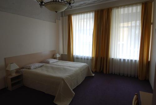 Postel nebo postele na pokoji v ubytování Vilnius centre house