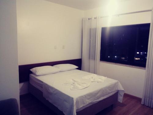 Cama ou camas em um quarto em Flat Luxo Bem Localizado No Bairro Da Barra Salvador
