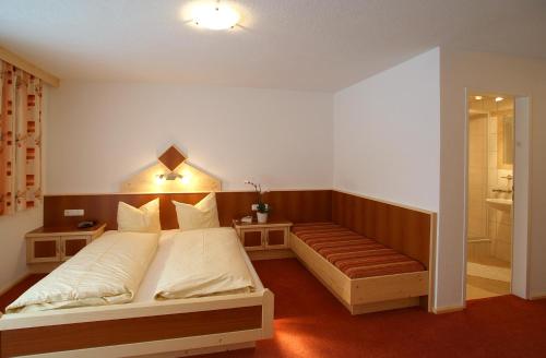 Postel nebo postele na pokoji v ubytování Apart la Montagnia