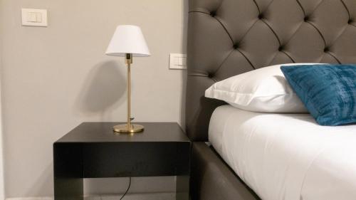 Postel nebo postele na pokoji v ubytování Compasso Suites