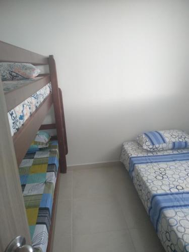 a bedroom with two bunk beds next to each other at Caffeto superstar 706 in Montenegro