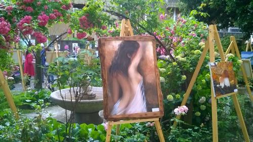 a painting of a woman in a garden at Vesna Loft in Luino in Luino