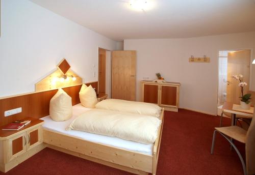 Postel nebo postele na pokoji v ubytování Apart la Montagnia