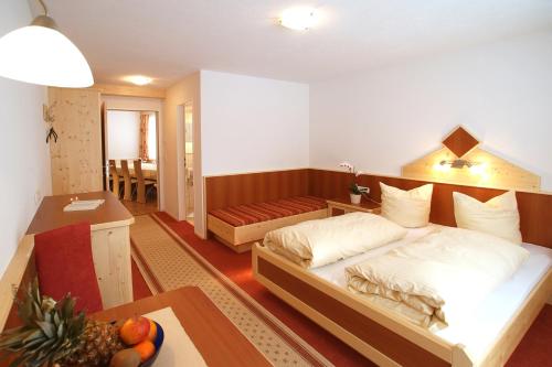 Postel nebo postele na pokoji v ubytování Apart la Montagnia
