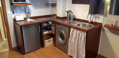 Кухня или мини-кухня в La Mediana Del Sella
