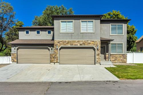 a house with two garage doors in front of it at Spacious & New Guesthouse in Orem/Provo in Orem