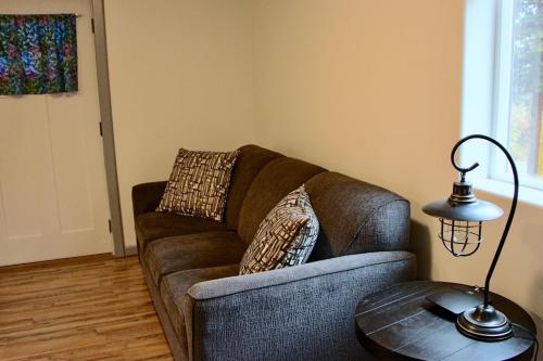 a living room with a couch and a table at Arctic Dragonfly Inn in Healy
