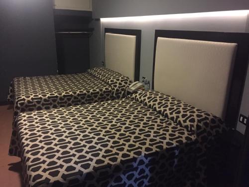 Кровать или кровати в номере Hotel Essen's