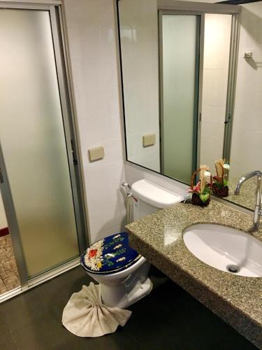 a bathroom with a toilet and a sink at Casa E Mare in Kata Beach