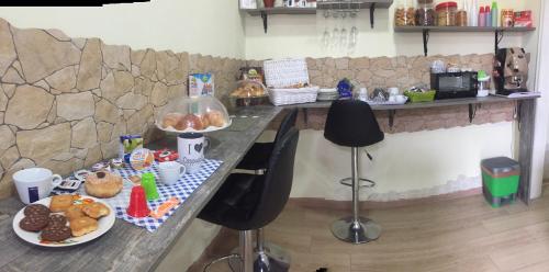a table with food on it in a room at Domus Stadio in Naples