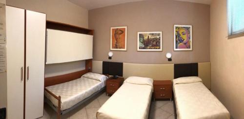 B&B Primerano SP73 tesisinde bir odada yatak veya yataklar