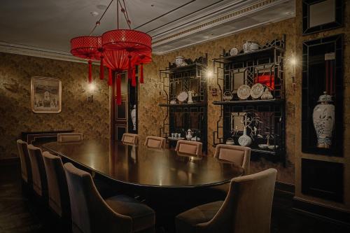 a dining room with a table and chairs at L'Escape Hotel in Seoul